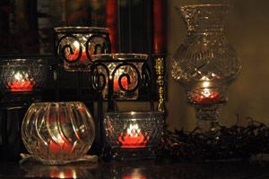 Red Beeswax Tealights candles in a variety of glass candle holders