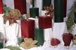 square and round beeswax pillar candles in holiday colors red and green