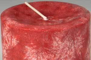 a red palm wax candle