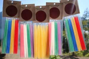 brightly colored packages of Beeswax Gala Candles for your Extraordinary Event