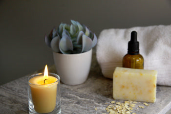 natural pure beeswax votive candle in a spa setting for relaxation