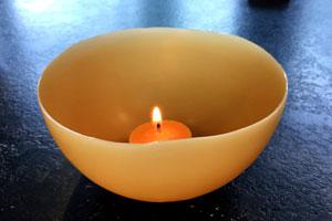 burning pure beeswax tealight candle in a homemade beeswax luminary