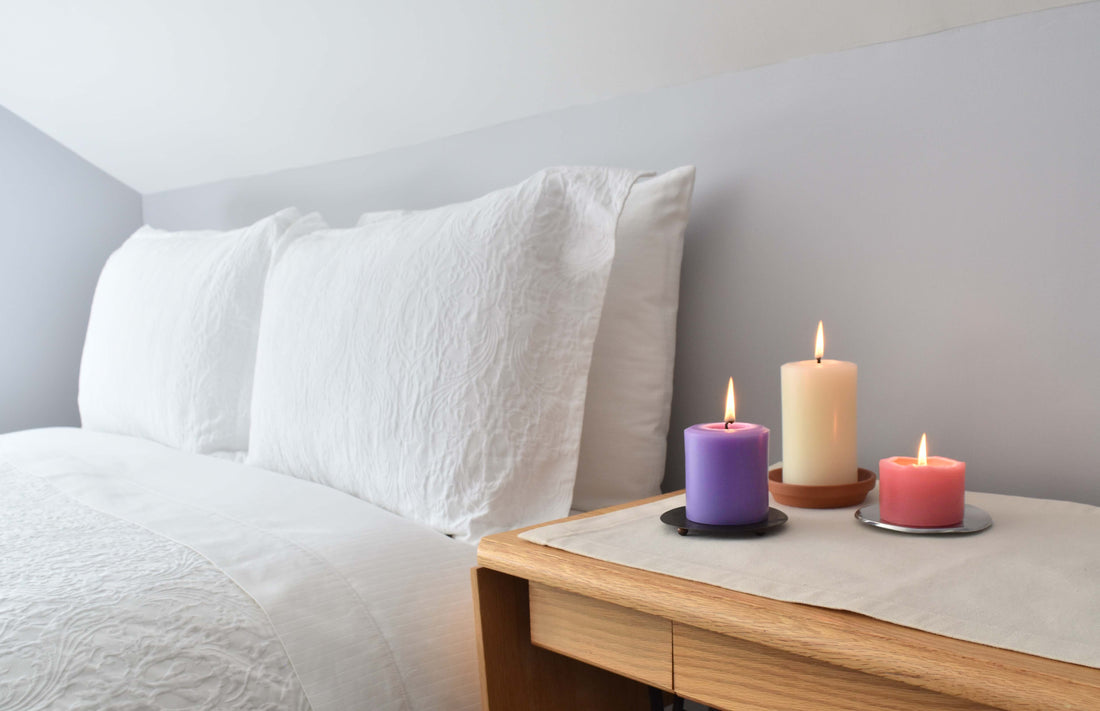 White, purple, and pink beeswax pillars for bedroom decor