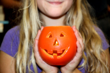 orange luminary carved into a perfect little pumpkin 