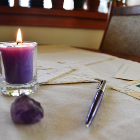 How do I properly burn a beeswax votive candle?