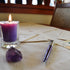 How do I properly burn a beeswax votive candle?