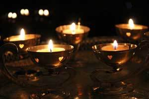 pure beeswax tealight candles burning in rows of lamps for the Diwali festival of light