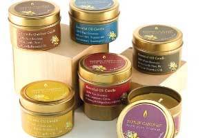  A group of 6 Honey Candles® Beeswax essential oil candle tins