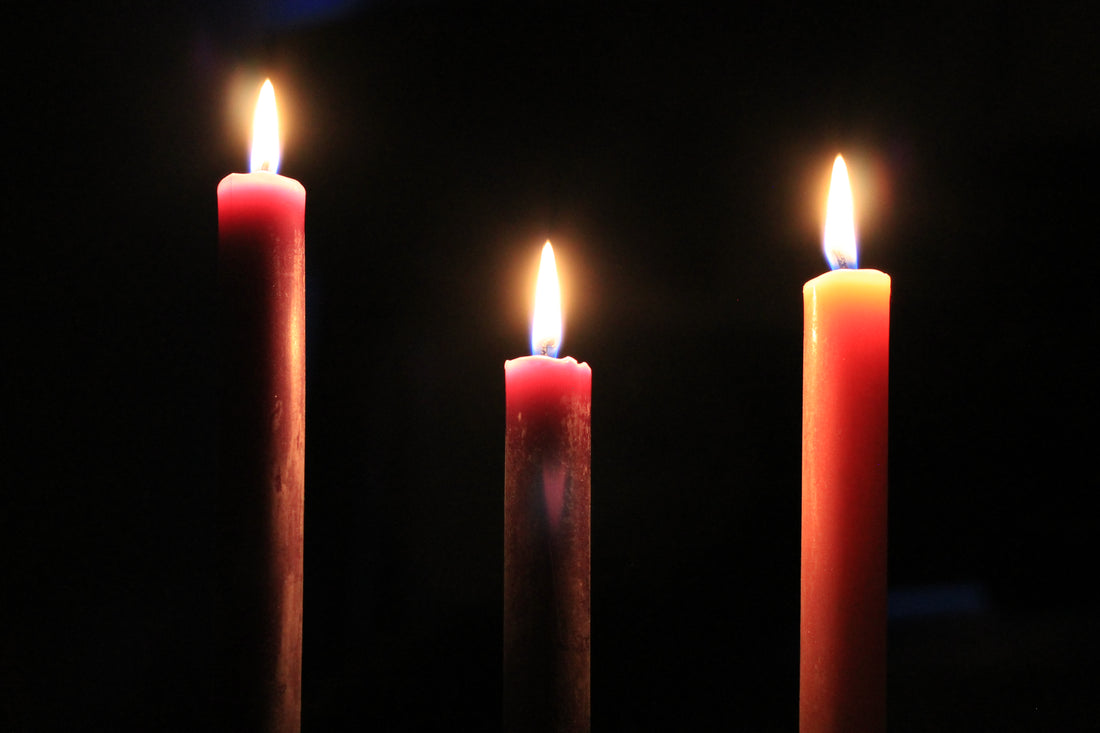 three pure beeswax taper candles burning get for winter months
