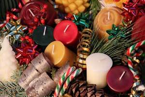 a Christmas centerpiece filled with pure beeswax votives in red, green, white, burgundy and natural color