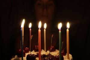 pure beeswax gala brightly colored candles burning on a beautifully decorated cake