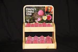 Rowan's Candle Fund display filled with pink pure beeswax candles