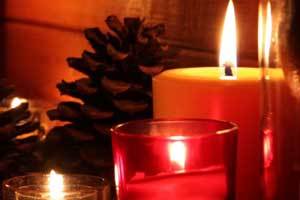 pure beeswax candles burning in glass holders 