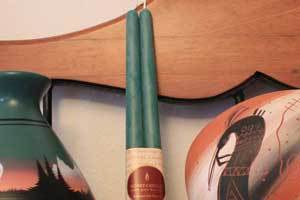 a pair of green pure beeswax taper candlesticks