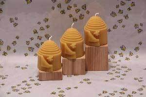 three peek a bee pillars on wooden blocks