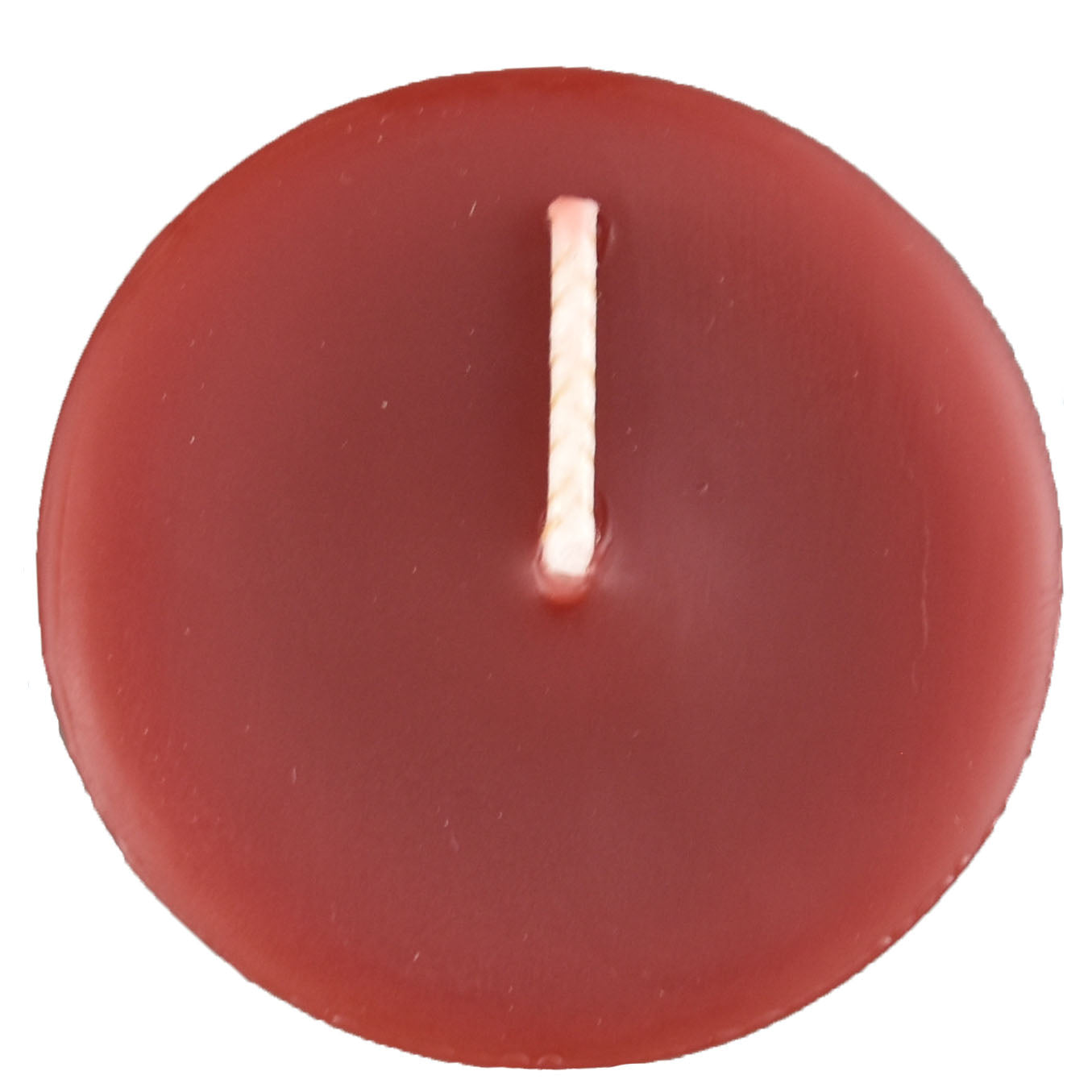 The top of a beeswax votive candle and wick, burgundy in color.