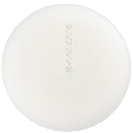 The top of a beeswax votive candle and wick, made from natural capping wax, white to pearl in color.
